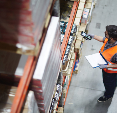Worker,With,Scanner,Making,Review,Of,Goods,In,Warehouse